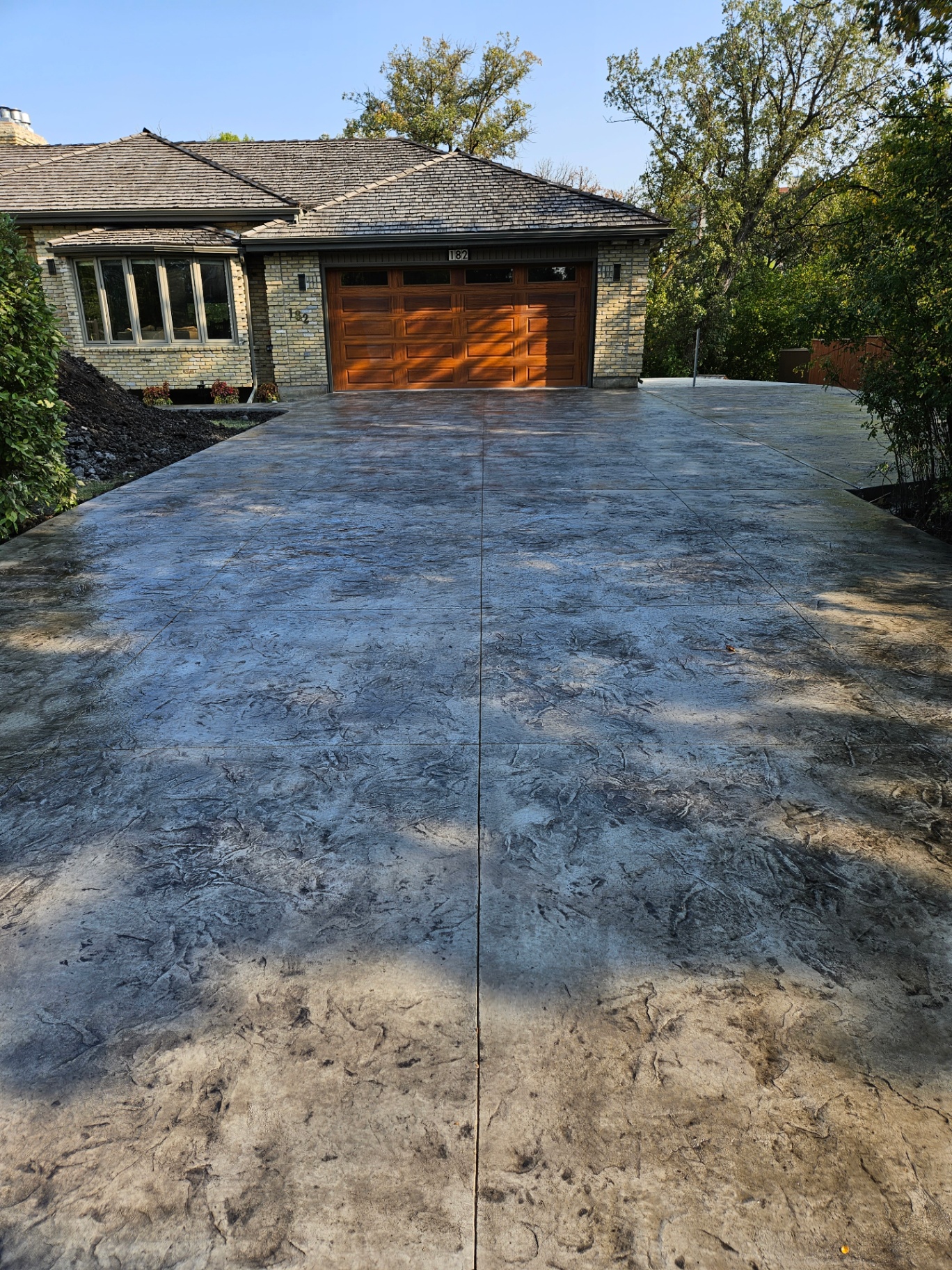 Stamped concrete driveway by Iberica Construction at a Winnipeg home